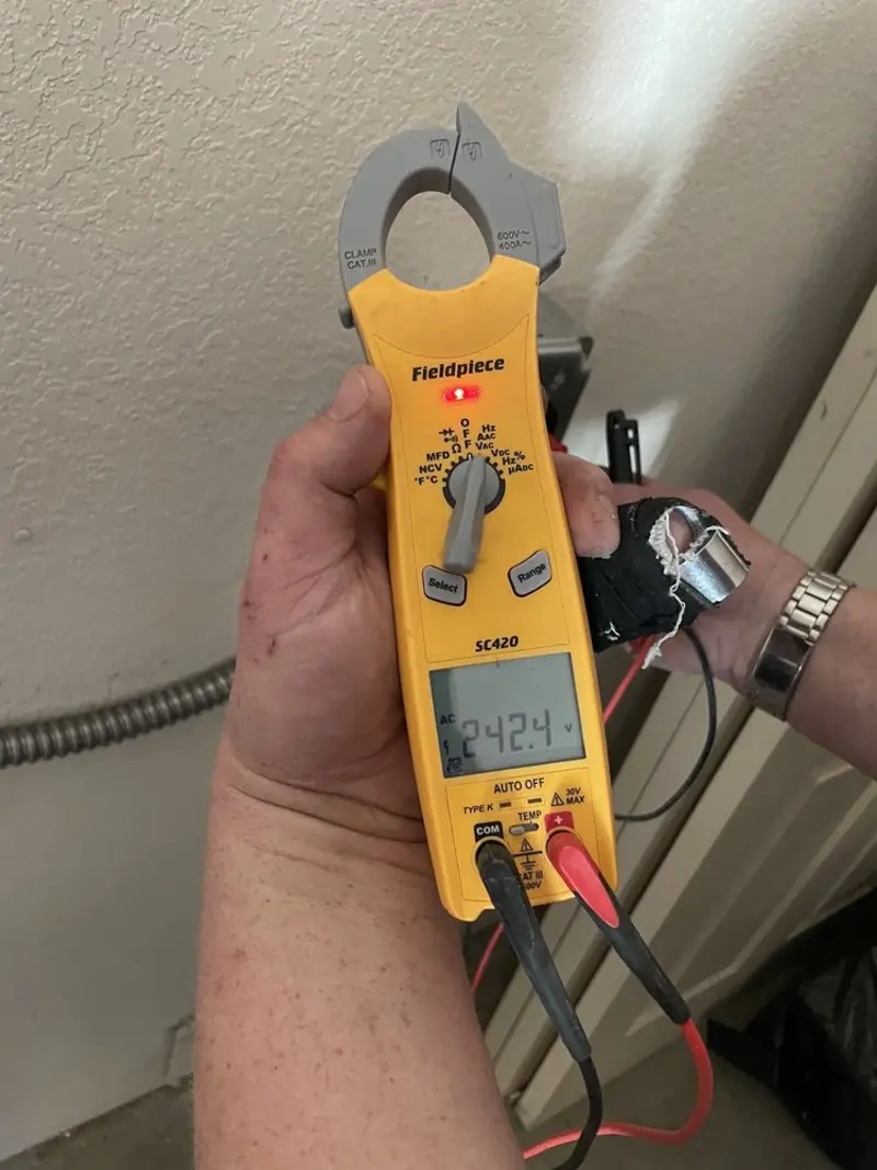 Voltage testing with clamp meter during Electrical Installation Services in Bountiful
